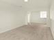 Bright living room featuring a pass-through window, recessed lighting, and plush carpet, creating an inviting atmosphere at 4103 Railhead Ave, Westfield, IN 46074