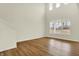 Spacious living room featuring beautiful hardwood floors, neutral walls, and large windows for natural light at 4103 Railhead Ave, Westfield, IN 46074