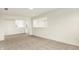Bright living room with pass-through windows, recessed lighting and neutral carpet; an inviting and open living space at 4103 Railhead Ave, Westfield, IN 46074