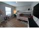 Bedroom with bunk beds, desk, and a large TV at 4175 Bozeman Way, Bargersville, IN 46106