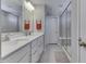 Modern bathroom with double vanity, large shower, and gray tile at 4223 Mardale Ln, Bargersville, IN 46106