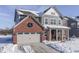 Two-story home with gray siding and brick accents, freshly fallen snow at 4223 Mardale Ln, Bargersville, IN 46106