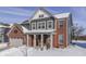 Two-story home with red brick and gray siding, festive winter decor at 4223 Mardale Ln, Bargersville, IN 46106