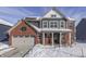 Two-story brick home with gray siding, snow covered lawn, and festive wreaths at 4223 Mardale Ln, Bargersville, IN 46106