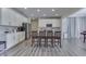 Modern kitchen boasts white cabinets, quartz countertops, and an island with seating at 4223 Mardale Ln, Bargersville, IN 46106