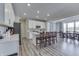 Open concept kitchen with island, white cabinets, and stainless steel appliances at 4223 Mardale Ln, Bargersville, IN 46106