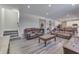 Open concept living area with hardwood floors and kitchen access at 4223 Mardale Ln, Bargersville, IN 46106