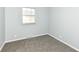 Bright bedroom with grey carpet and neutral walls at 435 Belmar Ave, Indianapolis, IN 46219