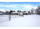 House backyard with a pool and chain link fence in the snow at 457 S High School Rd, Indianapolis, IN 46241