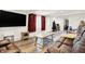 Finished basement with leather couches and large TV at 457 S High School Rd, Indianapolis, IN 46241