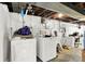 Unfinished basement laundry area with washer and dryer hookups at 457 S High School Rd, Indianapolis, IN 46241