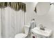 Clean bathroom with pedestal sink, shower, and new toilet at 457 S High School Rd, Indianapolis, IN 46241