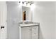 Clean bathroom with white vanity, granite countertop, and mirror at 457 S High School Rd, Indianapolis, IN 46241