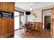 Cozy kitchen dining area with wood floors and view to backyard at 457 S High School Rd, Indianapolis, IN 46241