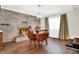 Cozy dining area with stone fireplace and wood table at 457 S High School Rd, Indianapolis, IN 46241