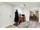 Bright entryway with coat rack and view to dining area at 457 S High School Rd, Indianapolis, IN 46241