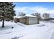Single car garage with snow covered driveway at 457 S High School Rd, Indianapolis, IN 46241