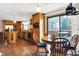Kitchen with dining area, oak cabinets, and backyard access at 457 S High School Rd, Indianapolis, IN 46241