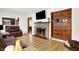 Living room with fireplace, built-in shelving, hardwood floors at 457 S High School Rd, Indianapolis, IN 46241
