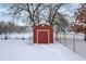 Red storage shed in snowy backyard at 457 S High School Rd, Indianapolis, IN 46241