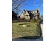 Brick house with a green door and well maintained lawn at 5724 Broadway St, Indianapolis, IN 46220