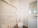 Bathroom featuring a glass-door shower, toilet, and vanity with sink at 6039 Granby Dr, Whitestown, IN 46075