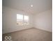 Bedroom with neutral carpet, a large window, and ample space for furnishings at 6039 Granby Dr, Whitestown, IN 46075
