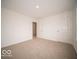 Bedroom featuring neutral walls, carpeted floors, and closet storage space at 6039 Granby Dr, Whitestown, IN 46075
