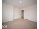 Bedroom with natural light, carpet, and doors to the closet at 6039 Granby Dr, Whitestown, IN 46075