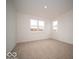 Sunny bedroom features plush carpet, neutral paint, and dual paned windows at 6039 Granby Dr, Whitestown, IN 46075