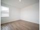 Cozy bedroom featuring hardwood floors, neutral walls, natural light through a window, and ample closet space at 6039 Granby Dr, Whitestown, IN 46075