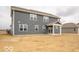 Back exterior view of a two-story home with a covered patio and siding at 6039 Granby Dr, Whitestown, IN 46075