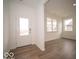 Bright foyer with hardwood floors, neutral walls, a clear glass door, and natural light through windows at 6039 Granby Dr, Whitestown, IN 46075