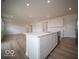 Open concept kitchen featuring an island, stainless appliances, and hard surface floors at 6039 Granby Dr, Whitestown, IN 46075