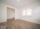 Bright living room with hardwood floors, neutral walls, natural light, and a spacious open layout at 6039 Granby Dr, Whitestown, IN 46075