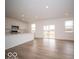 Spacious open-concept living area boasts lots of natural light and hard surface floors at 6039 Granby Dr, Whitestown, IN 46075