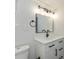Modern bathroom with white vanity, black fixtures, and large mirror at 6346 E County Road 100 S, Avon, IN 46123