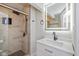 Bathroom with walk-in shower, modern vanity, and mirror at 6346 E County Road 100 S, Avon, IN 46123