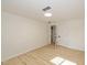 Bright bedroom with light walls, wood-look floors, and an open door at 6346 E County Road 100 S, Avon, IN 46123