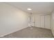 Simple bedroom with grey carpet and double door closet at 6346 E County Road 100 S, Avon, IN 46123