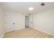 Bright bedroom with light walls, wood-look floors, and an open door at 6346 E County Road 100 S, Avon, IN 46123