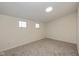 Bright bedroom with grey carpet and two windows at 6346 E County Road 100 S, Avon, IN 46123