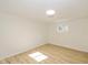 Simple bedroom with light walls, wood-look floors, and a window at 6346 E County Road 100 S, Avon, IN 46123