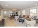 Open concept dining area with a modern table and chairs, adjacent to the living room at 6346 E County Road 100 S, Avon, IN 46123