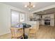 Bright dining area with sliding glass doors to backyard at 6346 E County Road 100 S, Avon, IN 46123