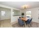 Dining room with a wood table, blue chairs, and natural light at 6346 E County Road 100 S, Avon, IN 46123