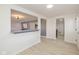 Clean hallway with light walls and wood-look floors, leading to other rooms at 6346 E County Road 100 S, Avon, IN 46123