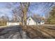 White ranch house with attached garage and mature tree at 6346 E County Road 100 S, Avon, IN 46123