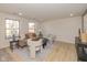 Bright living room features a neutral color palette, comfortable seating, and large windows at 6346 E County Road 100 S, Avon, IN 46123