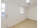 Simple spare bedroom with light walls, wood-look floors, and a window at 6346 E County Road 100 S, Avon, IN 46123
